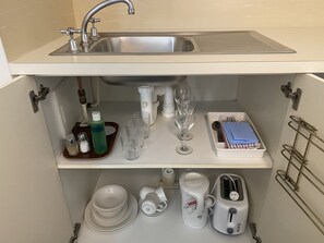 Fridge, microwave, electric kettle, cookware/dishes/utensils