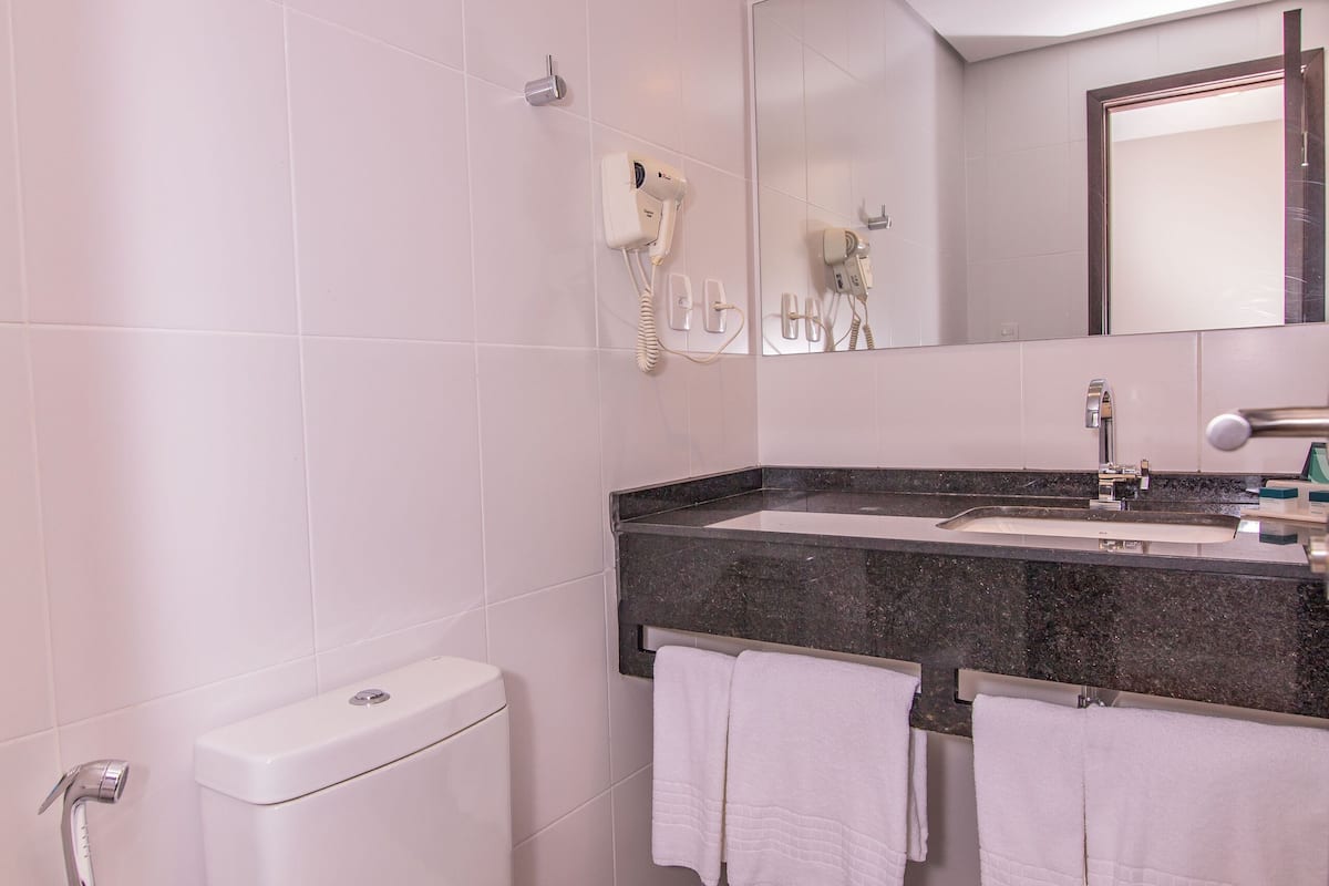 bathtub, free toiletries, hair dryer, towels