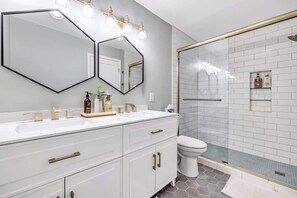 Combined shower/tub, hair dryer, towels, soap