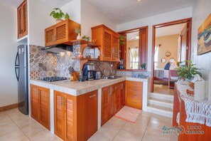 Fridge, microwave, stovetop, coffee/tea maker