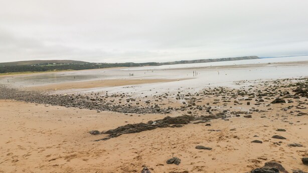 A beach with a rocky foreground and a sandy area. - Number 6 Oxwich Leisure Park (Swansea)