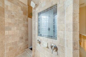 Combined shower/tub, hair dryer, towels, soap