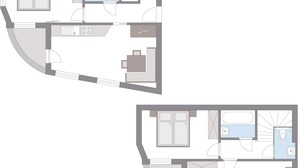 Un plan d’étage d’un hôtel comprenant deux chambres, une salle de bain, une cuisine et un espace de vie.