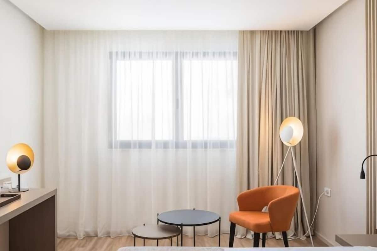 Hypoallergeen beddengoed, een minibar, een bureau, een laptopwerkplek