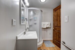Combined shower/bathtub, hair dryer, towels, soap