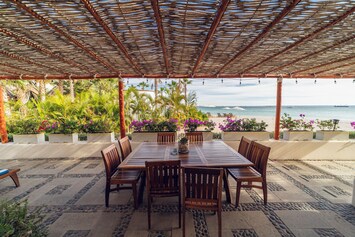 Dine under swaying palms.