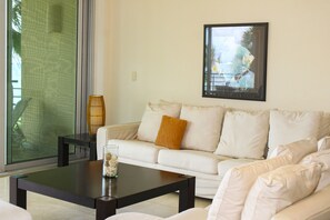 Luxury Apartment, 2 Bedrooms, Oceanfront | Living area | Smart TV - Luxury Apartament Punta Roca Ocean Front (Puerto Aventuras)