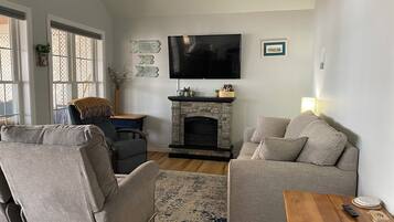 Smart TV, fireplace, books