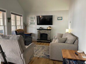 Smart TV, fireplace, books