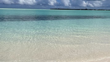 On the beach, sun-loungers, beach towels