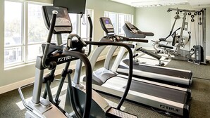 A gym with treadmills, ellipticals, and weight machines. - 1BR Horizons Condo On Beautiful Myrtle Beach Resort w/Amenities (Myrtle Beach)
