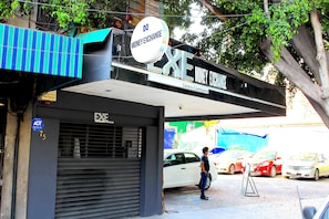 Located in a bustling urban area, this building offers a money exchange service.