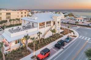 A coastal hotel with a rooftop bar, a parking area, and a view of the ocean. - 300 Feet from the Beach, Steps to the Seasonally Heated Pool - Cabana 111 at Gulf Place on 30A (Santa Rosa Beach)