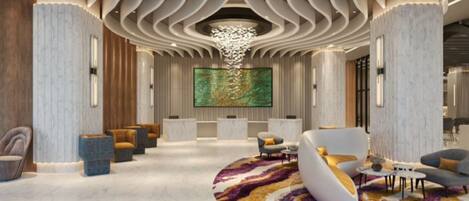 Un lobby moderno con un área de descanso curva, un cuadro abstracto de gran tamaño y un diseño de techo singular.