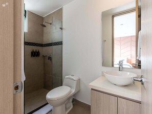 Shower, hair dryer, towels, shampoo