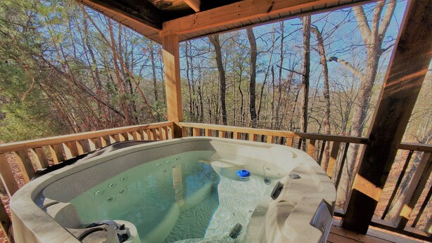 A hot tub on a wooden deck with a view of trees. - Villa Bonita/ Private Mountain top Cabin on 7.5 Acres w/Hot Tub (Sevierville)
