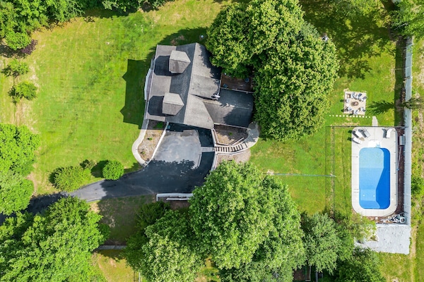 There is no shortage of trees on this property. While fall, summer & late spring display the richest foliage, you'll enjoy the natural beauty that surrounds you – no matter the season.