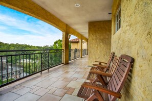 Relax in this serene outdoor space with a tiled floor and comfortable benches.