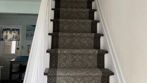 A staircase with patterned carpet and white railings. - Cozy Cottage 3 blocks to Town 7 to Beach 4 Blocks to Asbury (ocean grove)
