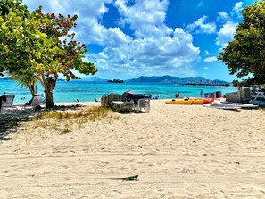 On the beach, sun-loungers, beach towels