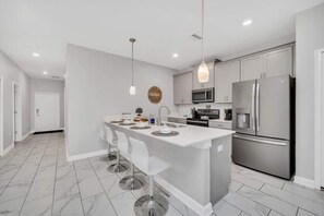 Fridge, microwave, oven, stovetop - 5BR ChampionsGate Villa • Resort Pool • 6mi Disney (Davenport)