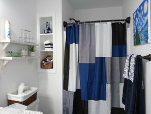 Combined shower/tub, hair dryer, towels, soap