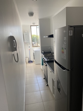 Fridge, microwave, oven, stovetop. Beautiful apartment in caldera near beach access