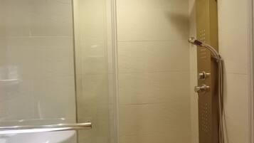 Shower, hair dryer, towels, toilet paper
