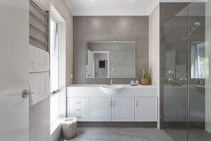 Shower, hair dryer, towels, soap