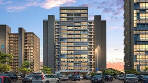 Um edifício moderno de vários andares com uma placa de destaque que diz 'ENGLISH TOWERS'.