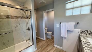 Bathtub, hair dryer, towels, soap