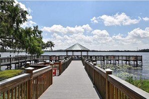 Guests can stroll along the pier to a serene gazebo overlooking the calm waters.