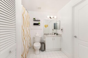 Combined shower/bathtub, hair dryer, towels, soap