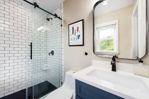 Combined shower/tub, hair dryer, towels, soap
