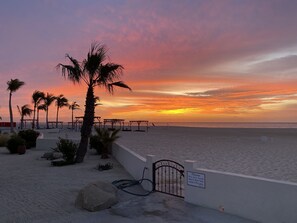 On the beach, sun loungers, beach towels