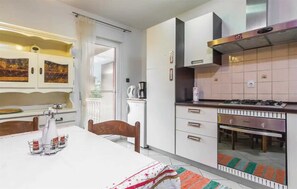 Enjoy meals in the kitchen with an oven and coffee maker, and dine at the table for two.