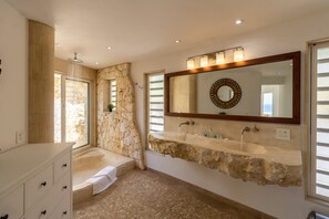 Bathtub, hair dryer, towels, soap