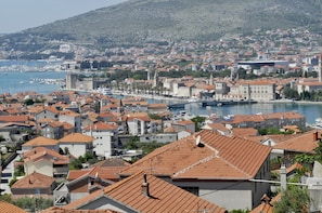 Experience the charm of a historic coastal town with a prominent tower and waterfront views.