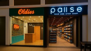 A store named 'Oldies' with a wooden counter and shelves filled with products. Adjacent to it is 'Pallise Your One Stop Shop' with a variety of items on shelves. - Luxurious Chalet in Port Said Governorate With Views (Al-Manasrah)