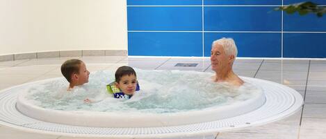 A hot tub with three people.
