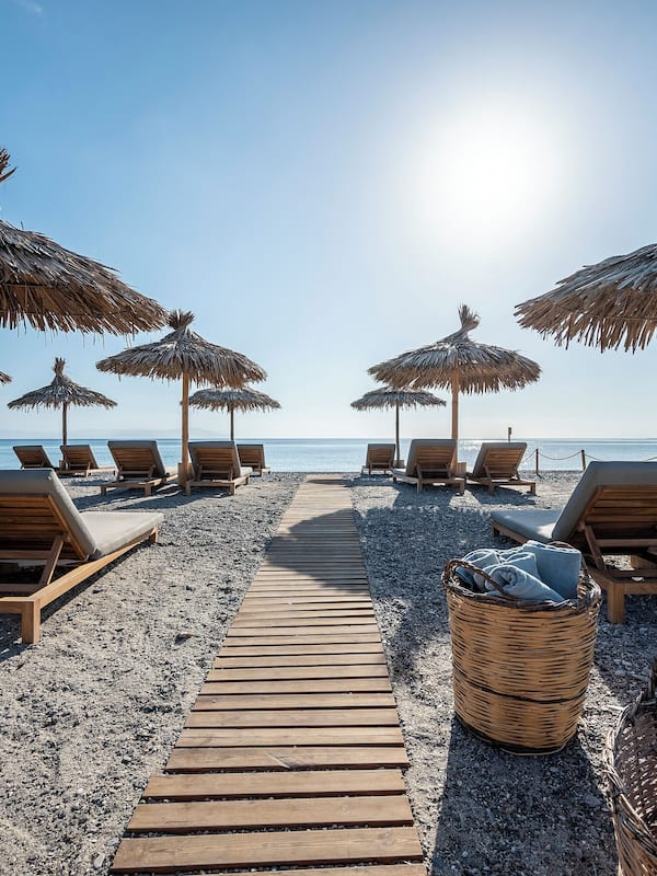 On the beach, sun loungers, beach umbrellas, beach towels