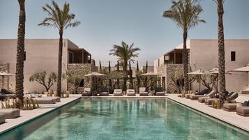 Seasonal outdoor pool, open 9:00 AM to 7:00 PM, pool umbrellas