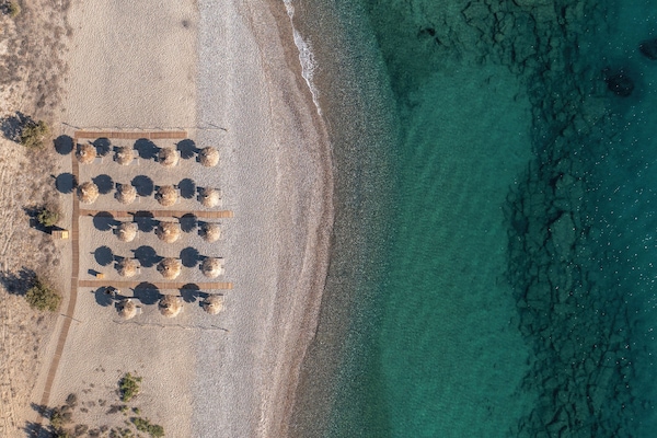 On the beach, sun loungers, beach umbrellas, beach towels