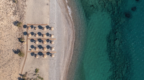 On the beach, sun loungers, beach umbrellas, beach towels