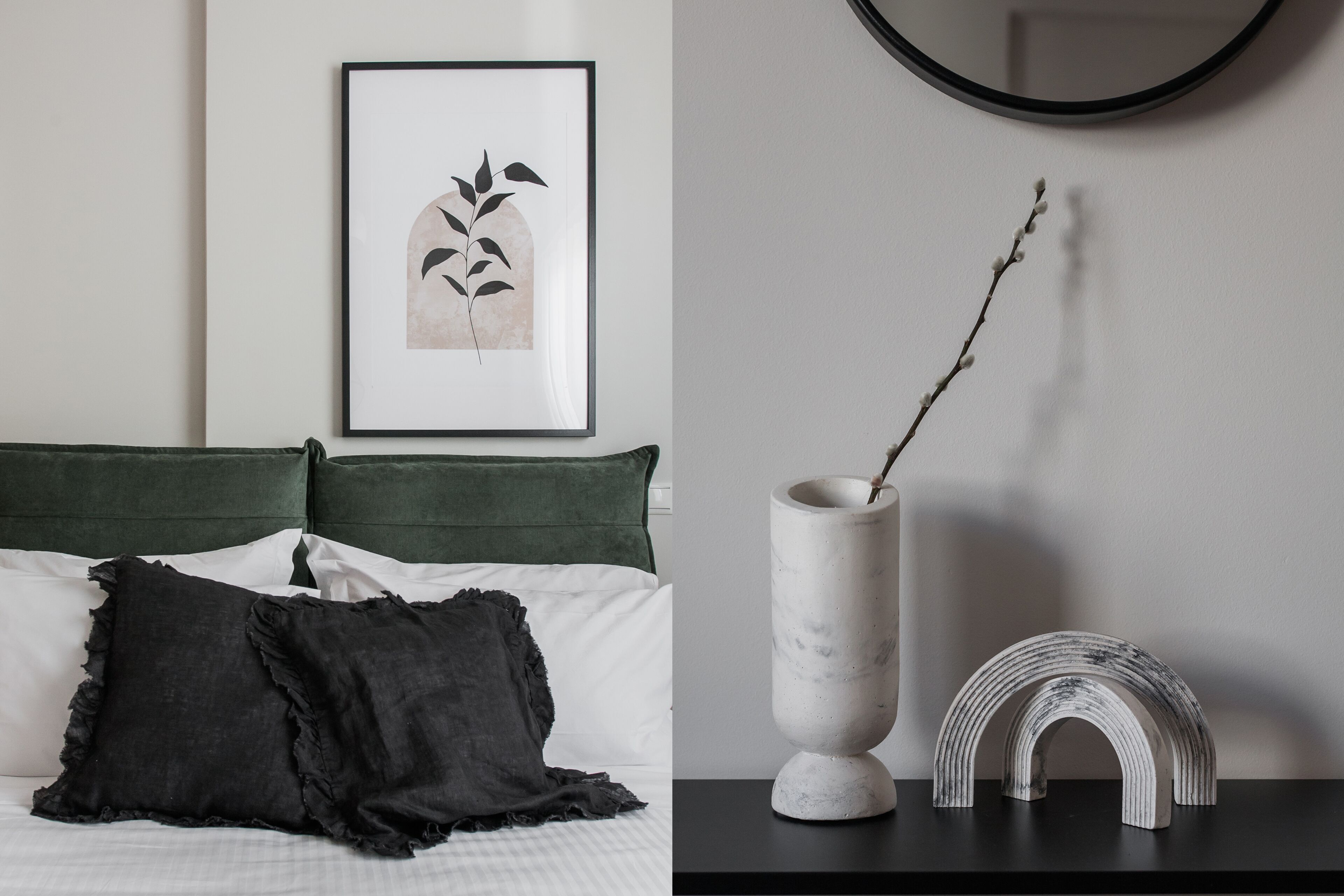 A bed with a green headboard, a framed plant, a vase with a branch, and a decorative arch on a black table.