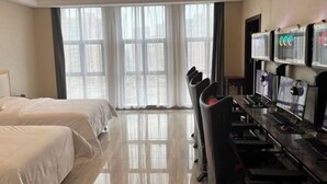 A hotel room with two beds, a desk with multiple monitors, and a large window with curtains. - Vienna International Hotel Kunshan Lujia Shentongyu Subway Station (Kunshan)