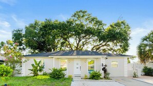 A single-story house with a front porch, a mailbox, and a number "8530" on the door.