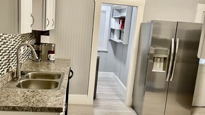 A modern kitchen with granite countertops, stainless steel appliances, and a walk-in pantry. - Kid friendly neighborhood!  Everyone is welcomed in this cozy apartment home! (Springfield)