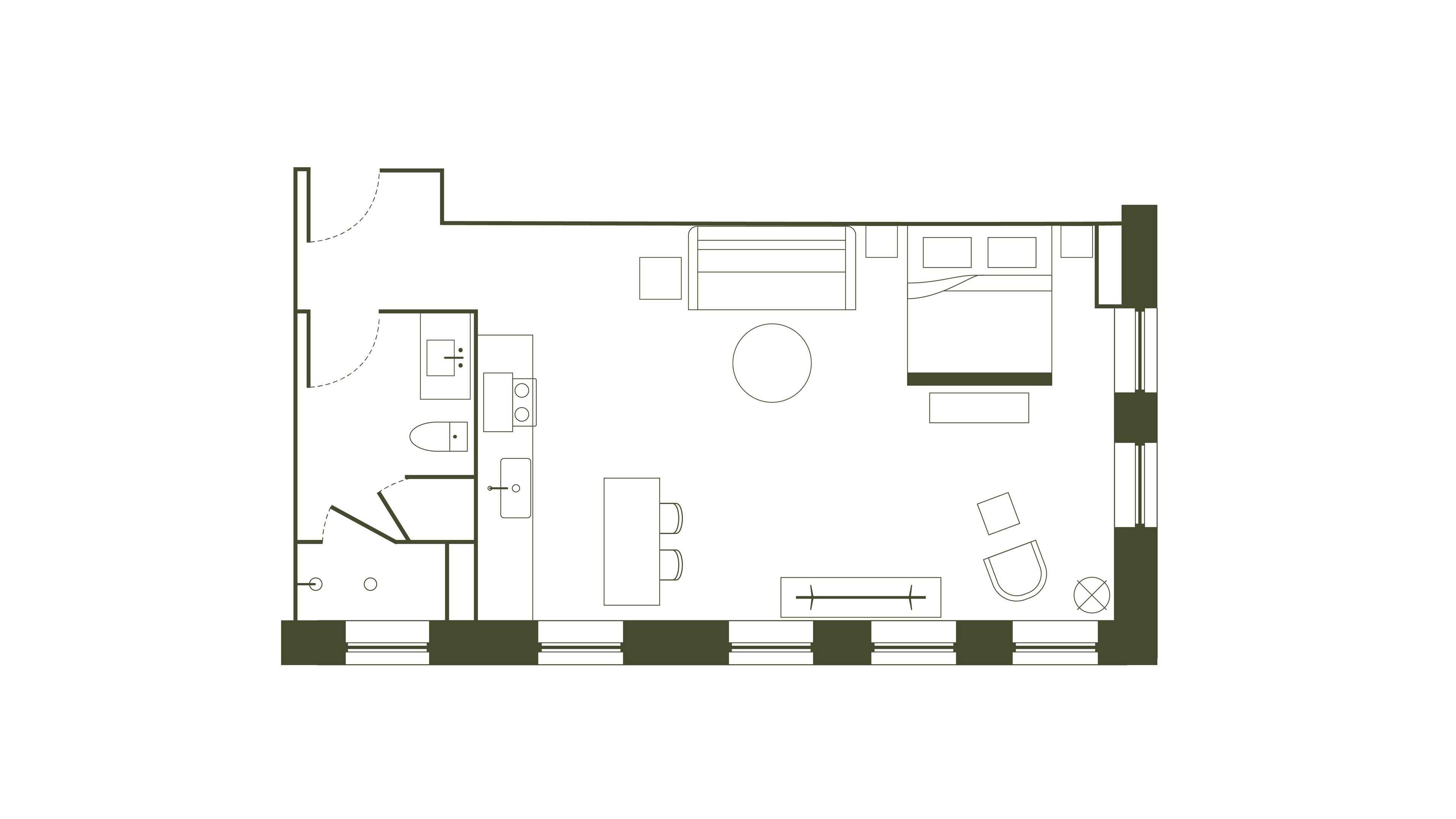 A floor plan of a hotel room with a bed, a desk, a chair, a small table, a sofa, and a window.