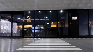 A clear "ENTRANCE" sign on the floor, a modern building entrance with glass doors, and a visible clock above the doors. - Hotel 24st Urban Brown Seosan Lake Park (Seosan)